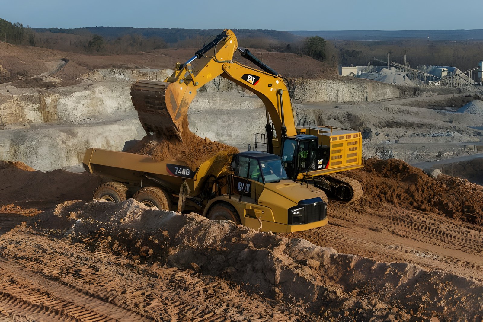 CAT excavator loading dump truck